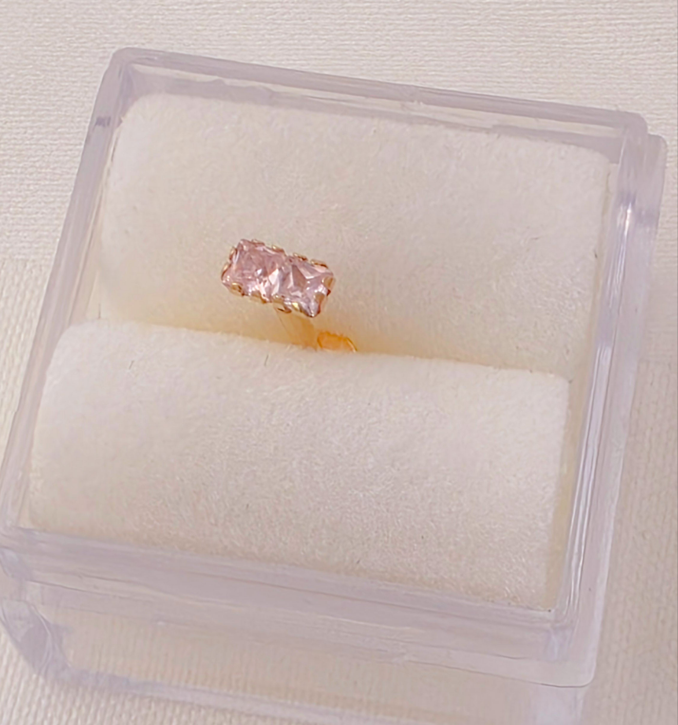 Two square 2mm x 2mm C2 cartilage piercing. 14k gold