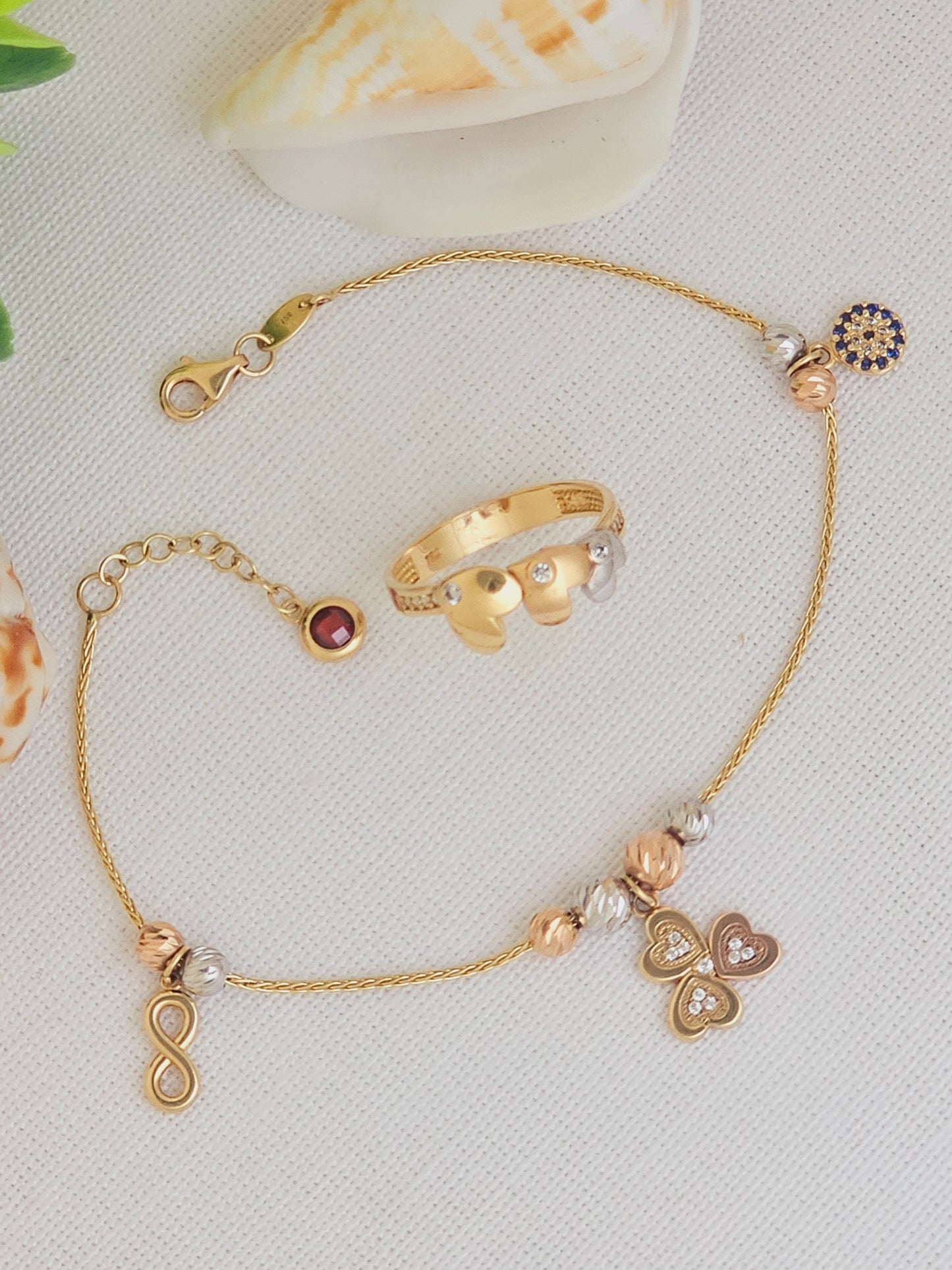 Pulsera de la suerte con trebol, Infinito y Ojo Turco en 3 tonos de Oro.