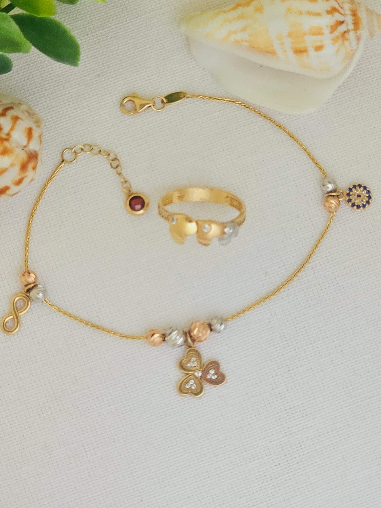 Pulsera de la suerte con trebol, Infinito y Ojo Turco en 3 tonos de Oro.