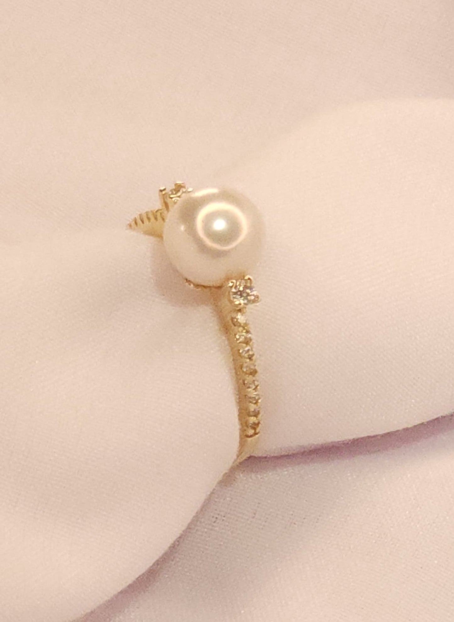 Gold Ring with Pearl and Crystal stones.