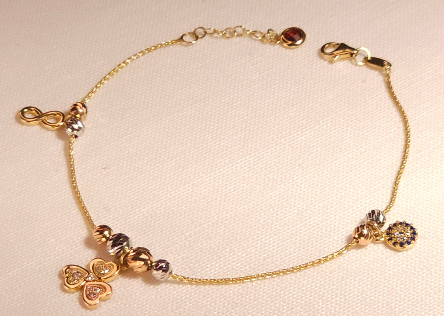 Pulsera de la suerte con trebol, Infinito y Ojo Turco en 3 tonos de Oro.