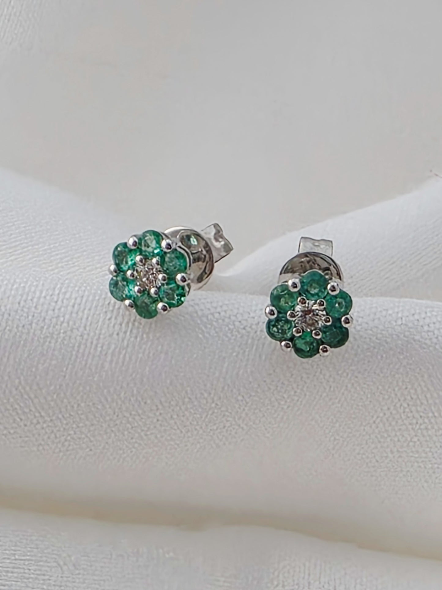 18K White Gold Emerald and Diamond Cluster Stud Earrings.