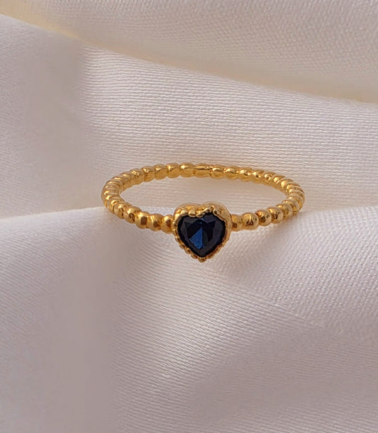 Twisted Gold Ring with Blue Stone.