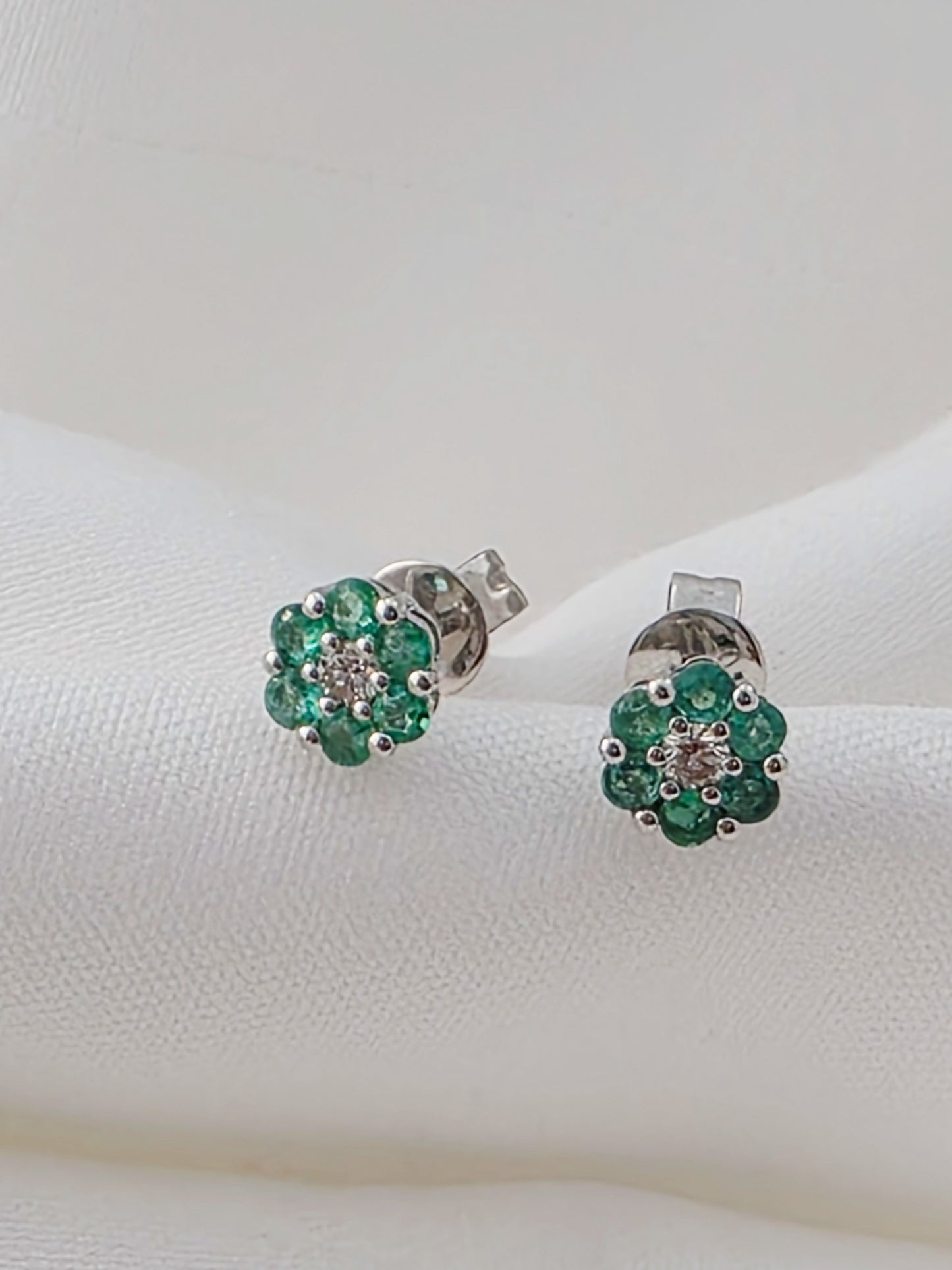 18K White Gold Emerald and Diamond Cluster Stud Earrings.